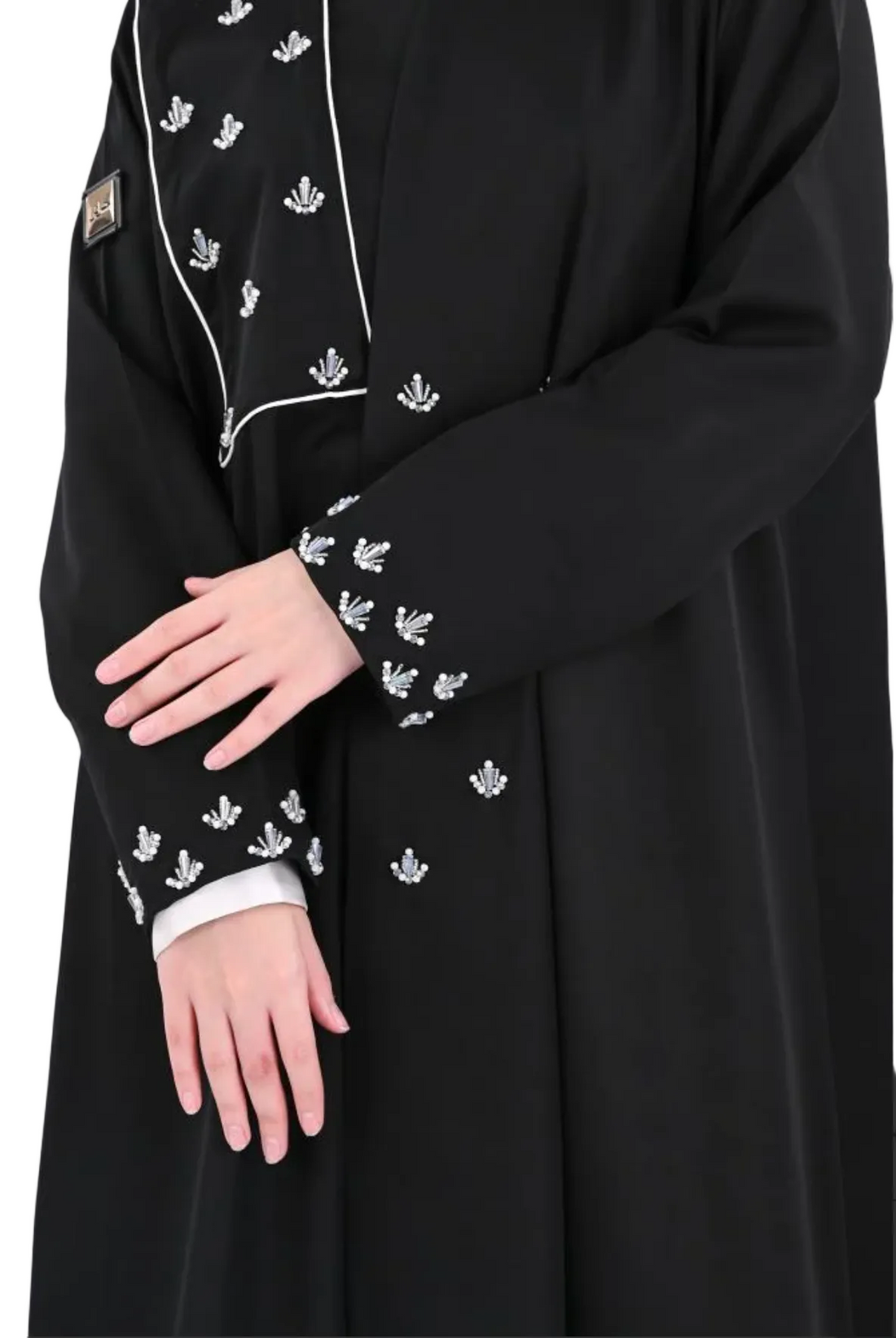 A flared abaya with hand-beaded embroidery